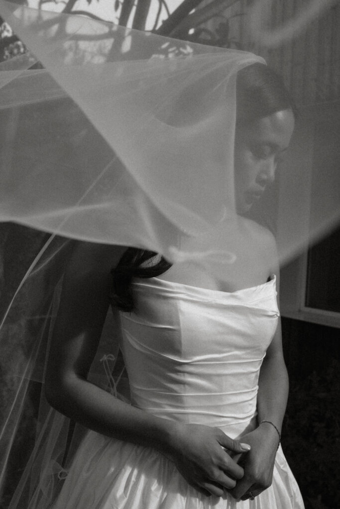 A bride with a flowing veil, shot in black and white